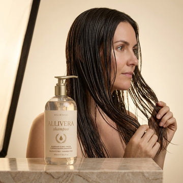 Oliesse Allivera shampoo bottle on a shower ledge